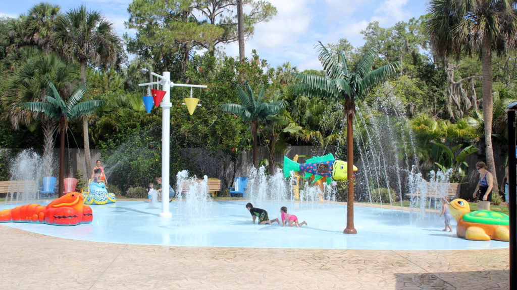 Two children play in the splash pad